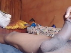 Straight hunk lying down on bed jerking off in gay porn video