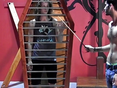 Caged boy is in for a merciless anal surprise