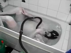 in white zentai in the bathtub