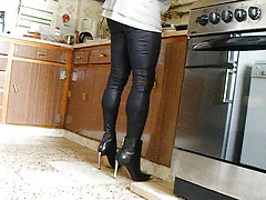 Walking with shiny leggings and heels.