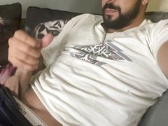 Bearded guy having fun jerking off and cumming a lot