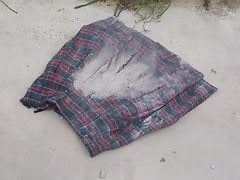 crush wet ash on red tartan skirt