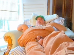 Bib overalls on farmer grandfather with broad feet has hands-free throughout the room