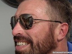 Big cocked Parker Kane bends his ass for dildo drilling and fist fucking