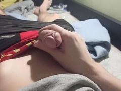 Dude in shorts strokes his thick meat and cums while chilling at the computer