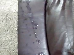 Cumming on leather sofa