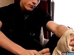 Attractive twink teases with his toes while stroking his schlong
