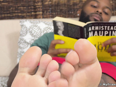 Ebony jock Dallas shows off his size 12 feet in dirty socks