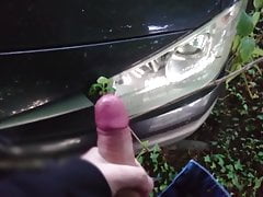 Masturbating in front of a black car