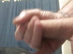 Guy strokes cock and cums