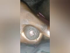 Guy gently stroking his black cock until he cums.