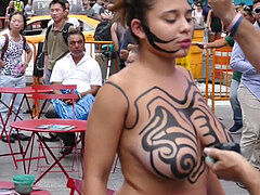 stunning bare-chested woman Getting Painted