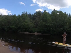 Girl On A Hiking Trip On A Sup Board