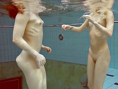 Two hot girls enjoy the pool naked