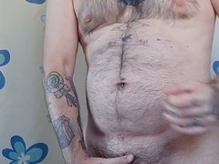 Hairy daddy peels off his white boxers and strokes himself before hopping into the shower.