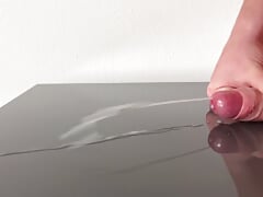 Huge cumshot on reflecting table after days of edging
