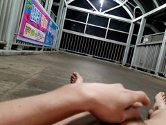 Masturbating on a bridge outside at night