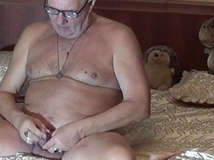 Mature grandpa enjoys pleasuring himself with a handjob until orgasm