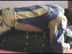 the slave in sleepsack with master in bikersuit
