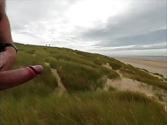 Hard cock pissing on beach