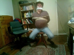 Cowboy In Dark Red Shirt Tied Up And Gagged
