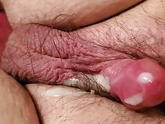 Shaking small cock to get it to cum.