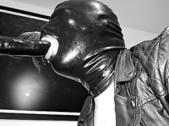 Slave deepthroat in leather and latex