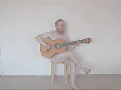 DJ Phuzzy plays guitar naked