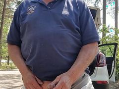 Outdoor Chris in parking lot traffic pasing by