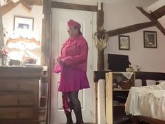 In fuchsia flight attendant attire