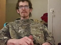 Denzel James masterbates in his chair in camo sweater