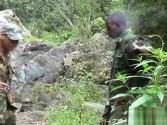 Two military lads resting by the river