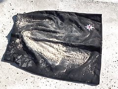 crushing wet soil on black skirt & washing