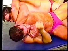 Fit studs wrestle on the rink half naked