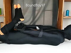 Lycra Guy hogtied on table.