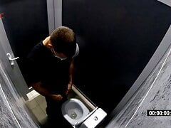 Spy hidden camera in a men's public toilet. Peeping