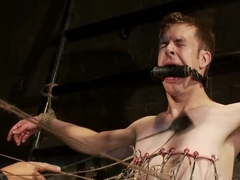 Pale man is tied and his cock gets juiced by the tall DILF