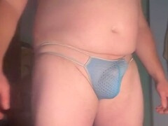 Tight blue thong showing off a tempting bulge