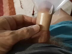 Jerking off with and without a funnel while watching TV