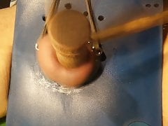 With a wooden mallet and a little hand in the balls