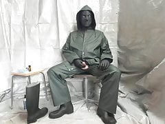 Wanking in Green Coat and Mask