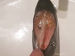 Whore's shoe filled with hot piss