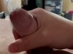 Draining off into a rubber and toying with the spunk