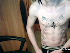 Tattood lad plays with his ginormous uncut dock
