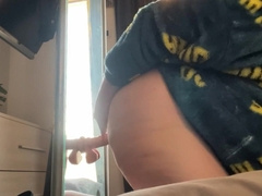 A plump fellow who is sexually engaged is at home by himself