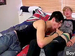 The youngsters are making out on the couch and exposing dicks