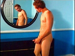Horny twink watching himself masturbate