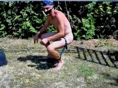 naked hot slave outdoor swinging at big balls BDSM CBT