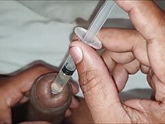 Srilankan younger boy oil injection to he Big Penis and hand job in oily Penis