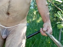 Village exhibitionist struts around in sheer panties for a public show